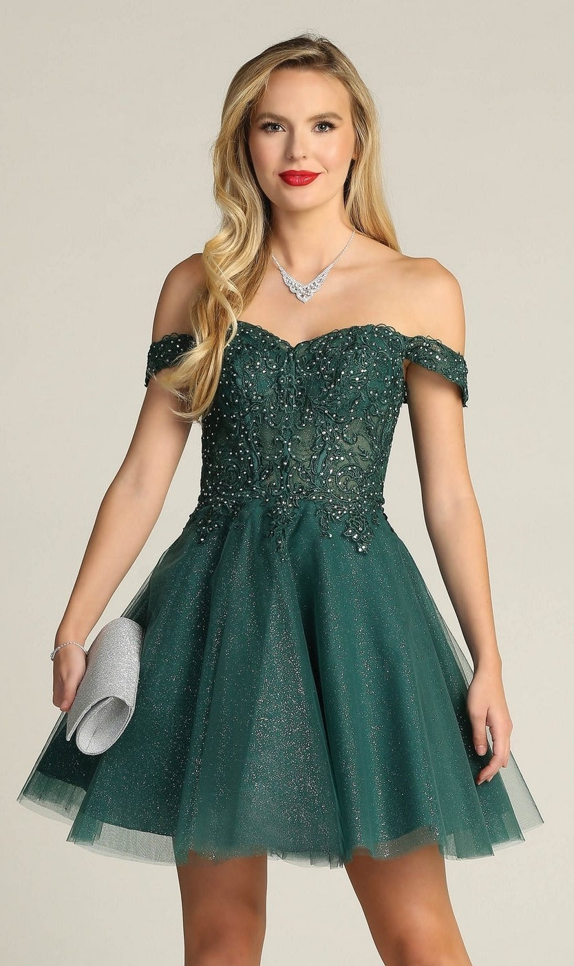 Woman in the Off-Shoulder Short Glitter Homecoming Dress C318, a sparkly dark green style, holding a silver clutch. She has long blonde hair and red lipstick.